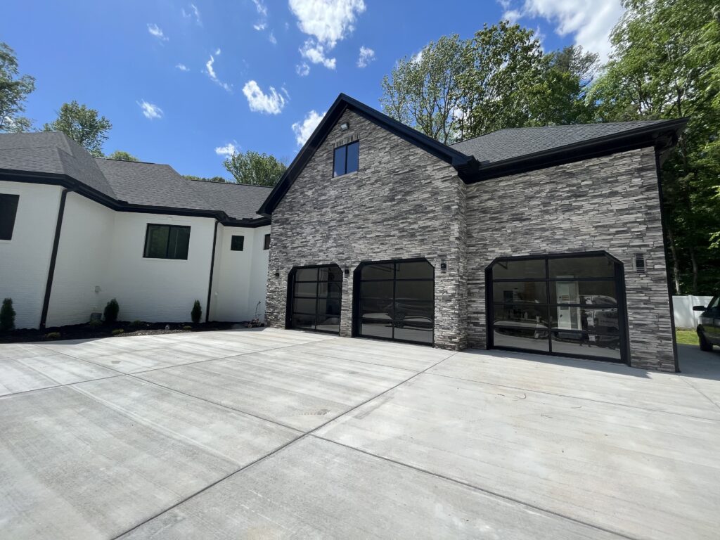 Modern full view garage doors with black frames