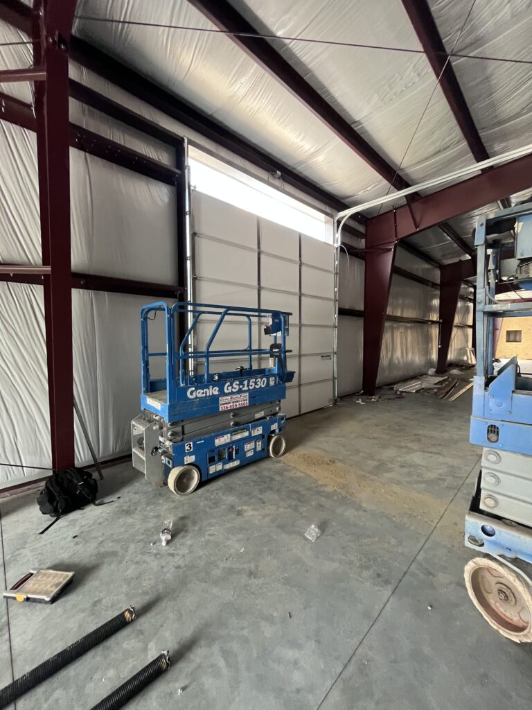 Commercial sheet door in the process of being installed 